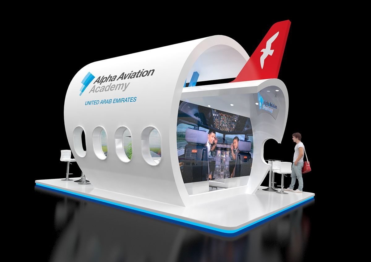 Alpha Aviation Academy exhibition stand shaped like an aircraft fuselage with a flight simulator inside