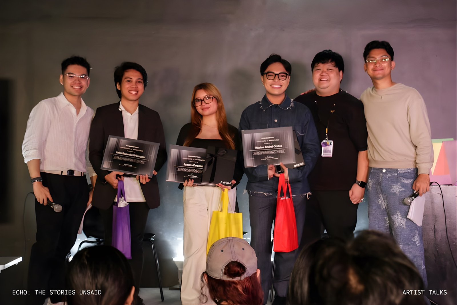 John Benedict with fellow speakers holding certificates of appreciation